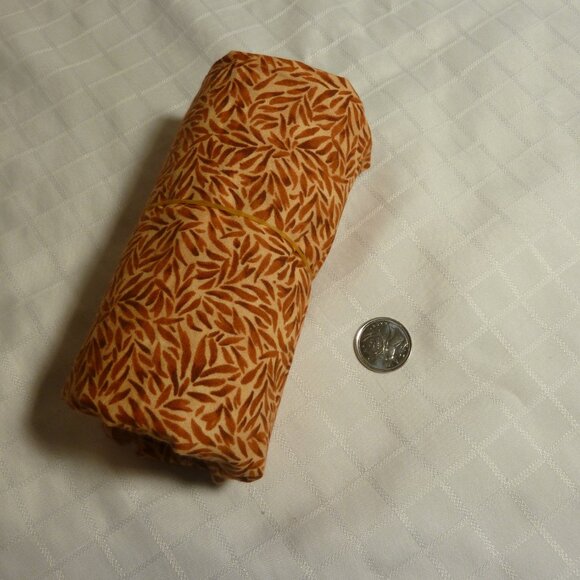 Fabric with abstract natural pattern in shades of orange, brown, and beige - Picture 3 of 3